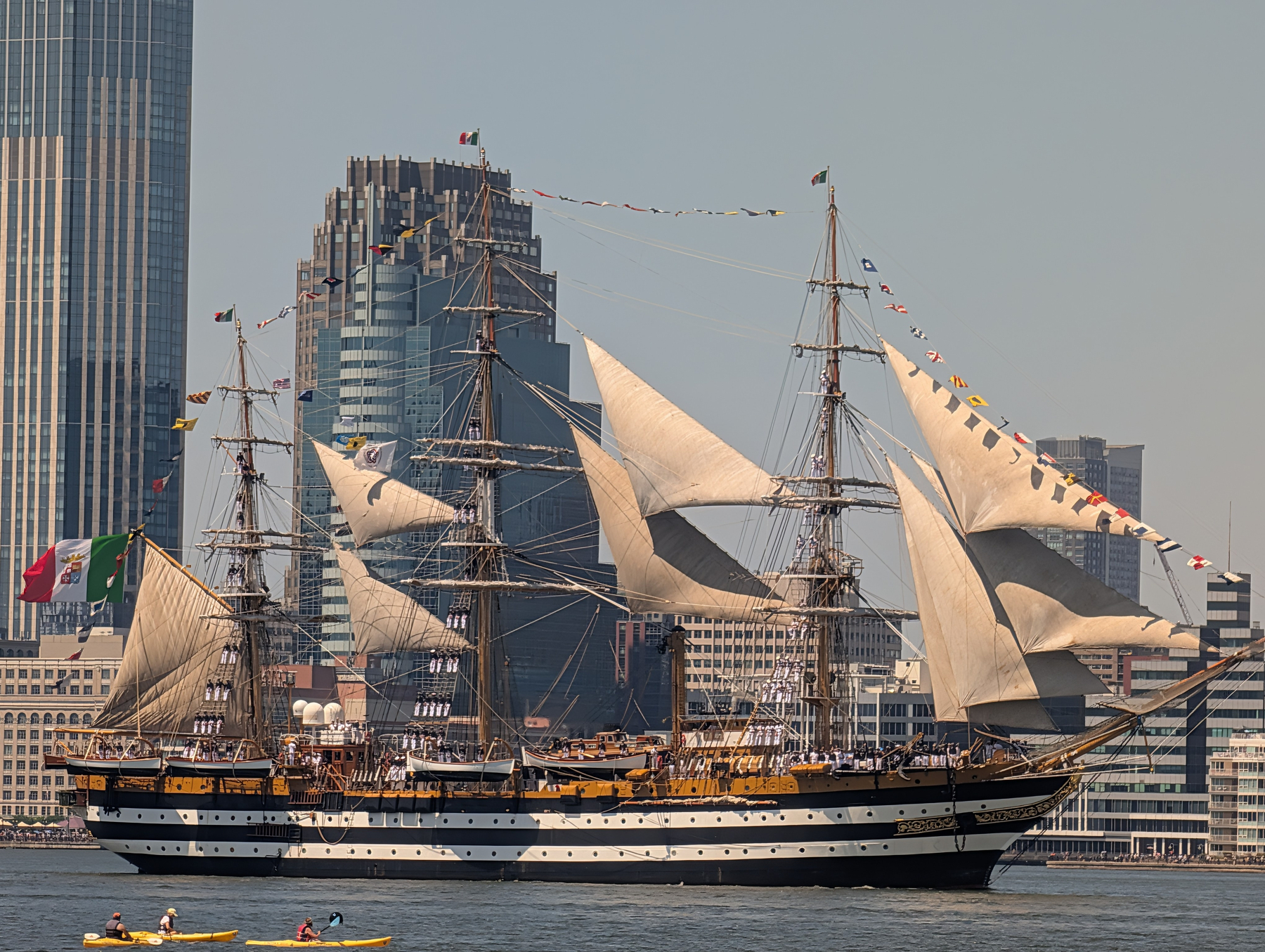 The Amerigo Vespucci ship sailing in New York Harbor as part of the Sail 250 parade on July 4, 2026. The sailors standing on the lines here make for an impressive showing.